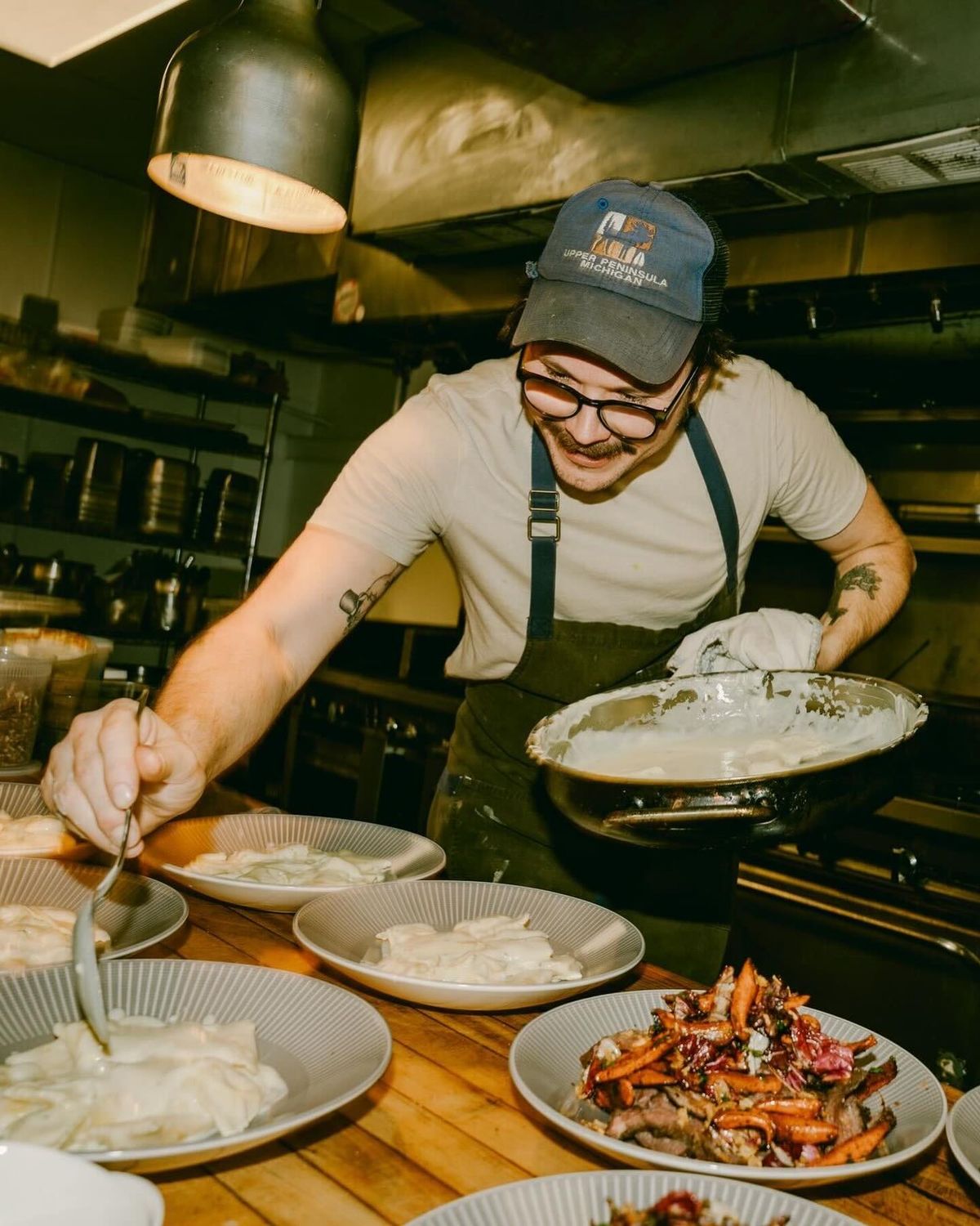 Chef plating food truck special with focus