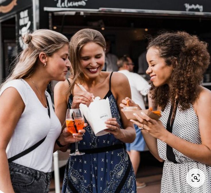 Friends sharing a meal from a food truck
