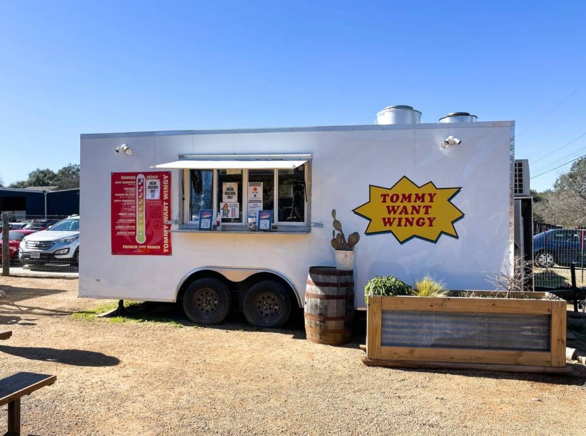 Customer ordering at a food truck window